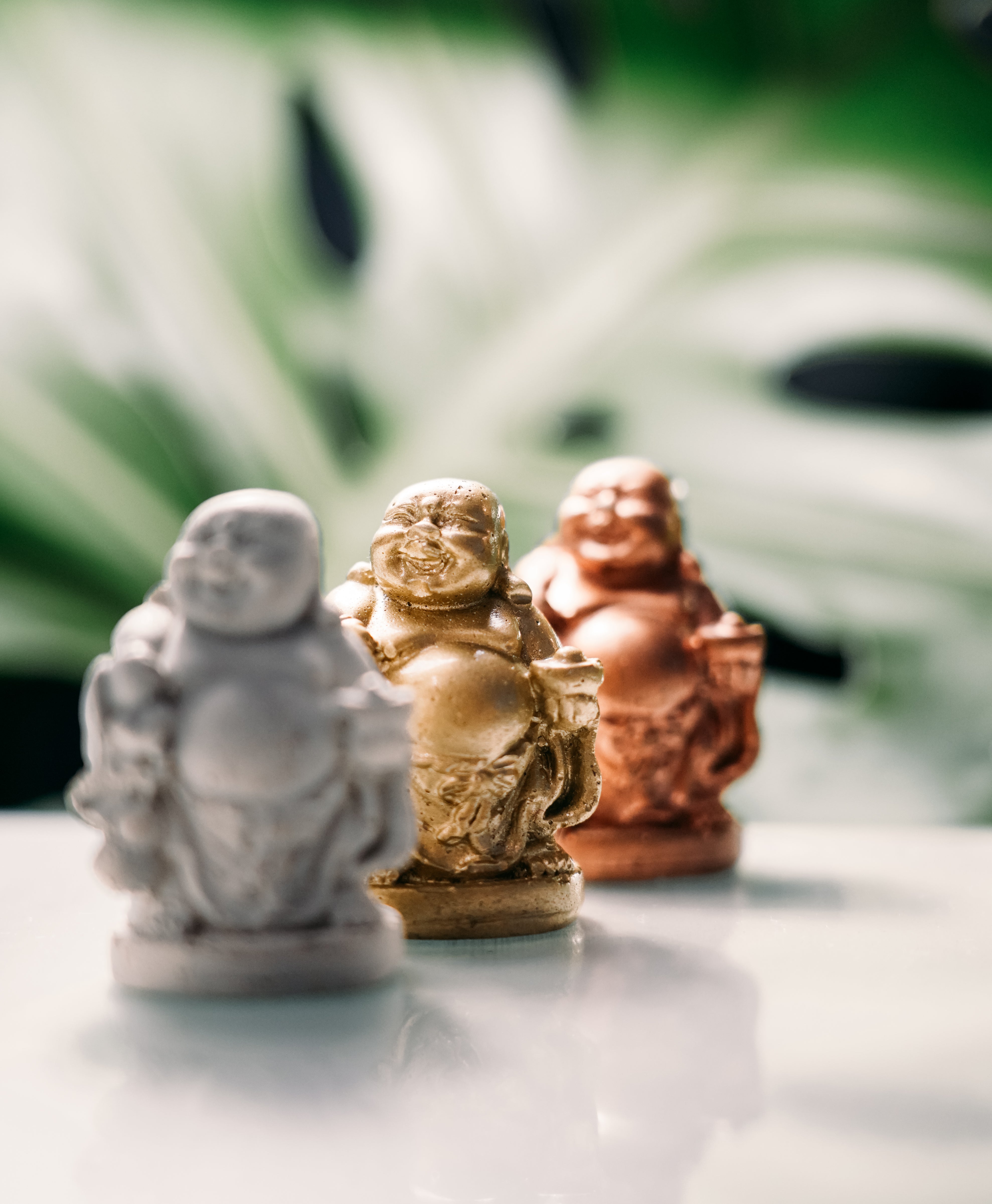 laughing buddha concrete statues in gold rose gold and concrete