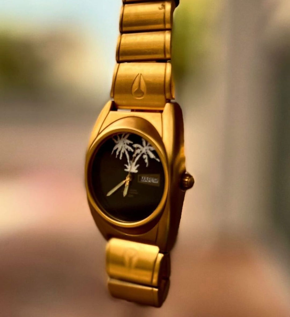 A custom gold Nixon watch