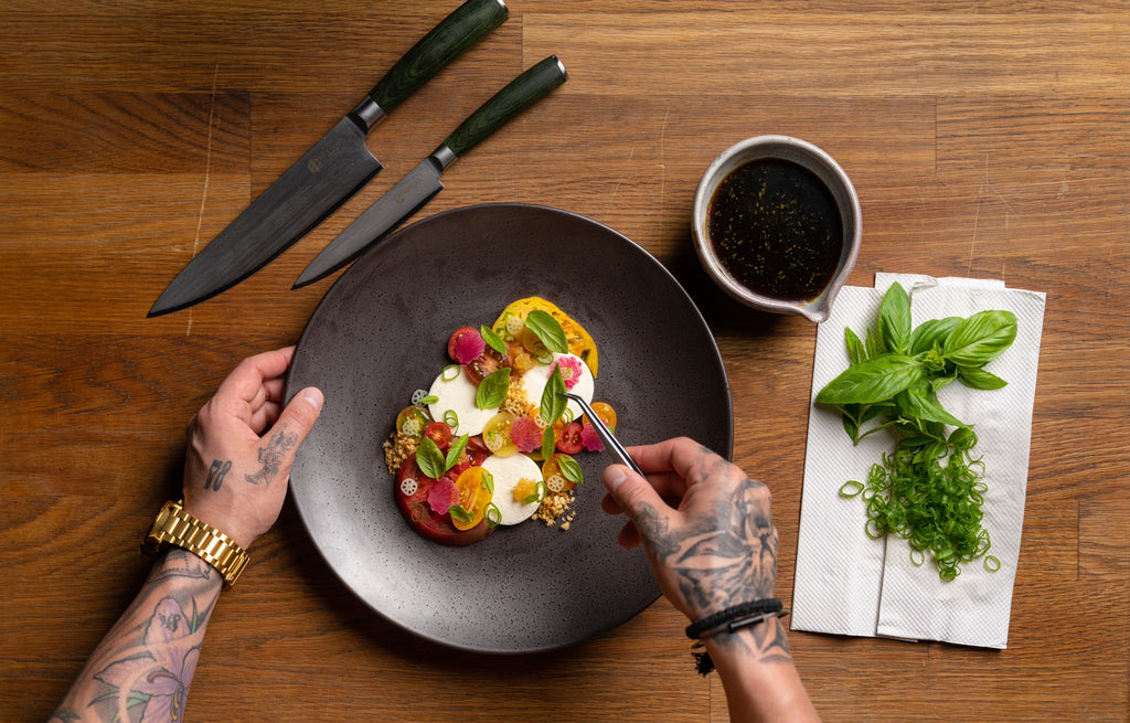 Chef Robbie Felice puts the finishing touches on a dish