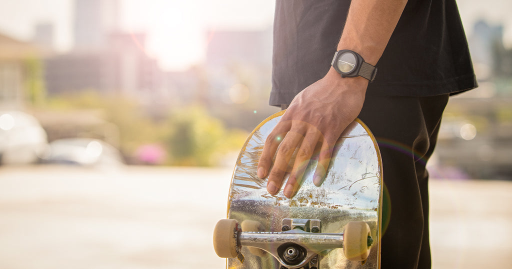 Skateboarder wears a Nixon Light-Wave Solar watch