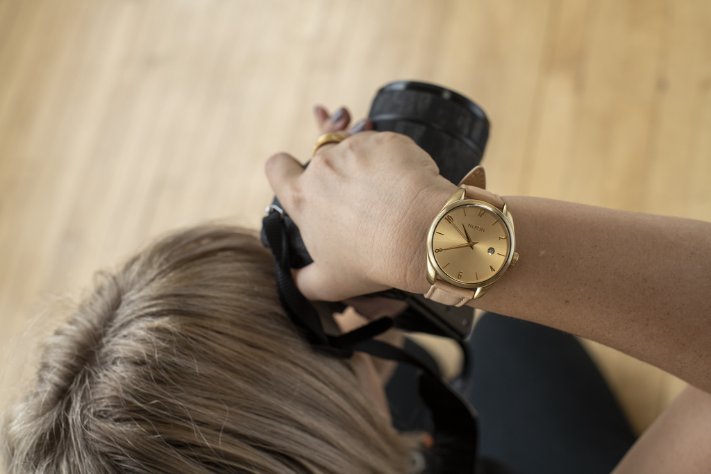 Photographer wearing the Nixon Thalia women's Quartz watch