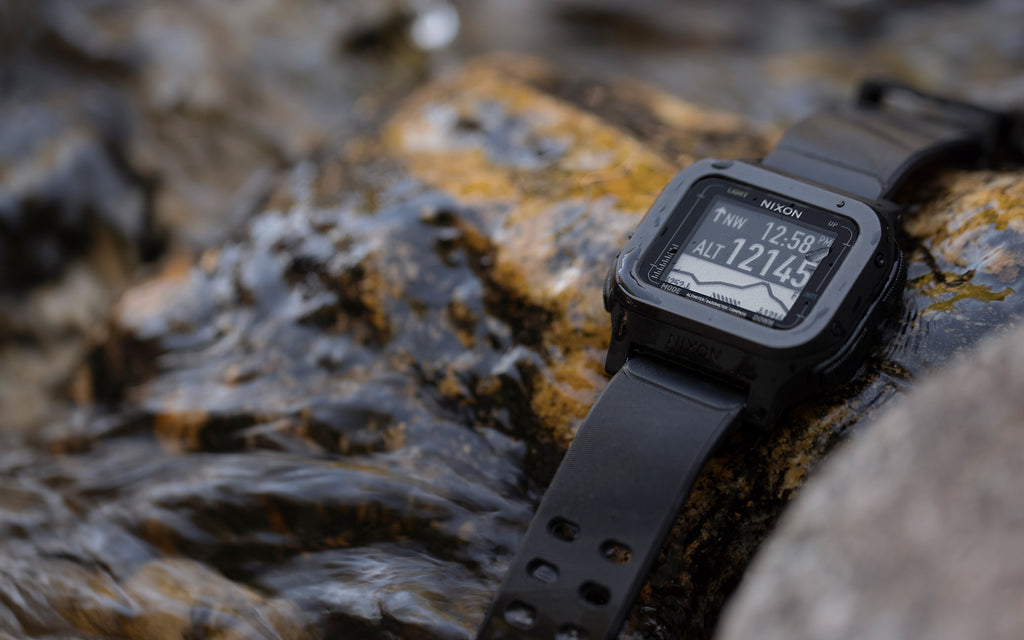 A Nixon Regulus Expedition sits on a rock