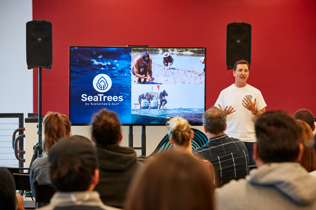 Nixon employees watch a SeaTrees and Sustainable Surf presentation