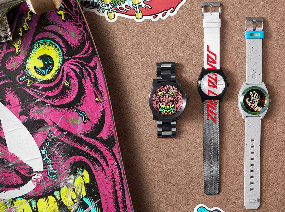 Nixon x Santa Cruz watch collection next to a Santa Cruz skateboard