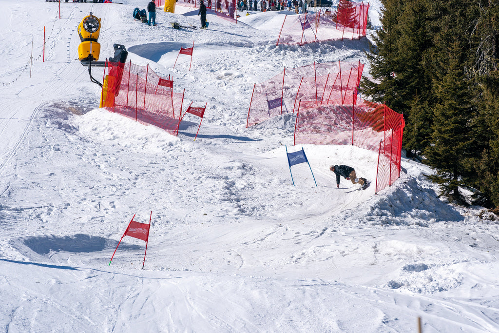 A snowboarder rides downhill at Sudden Rush Banked Slalom LAAX