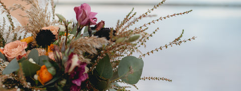 Rustic wedding bouquet with warm clour tones. Lake Bumbunga in the background