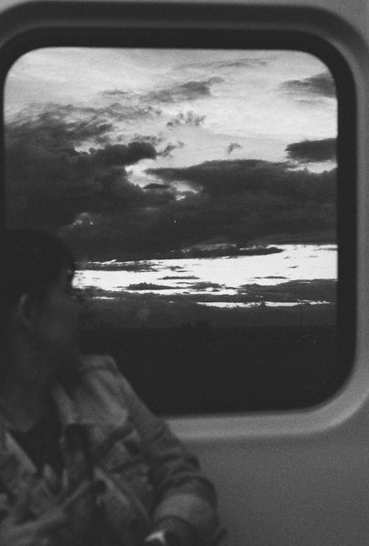 Photograph looking outside a train window