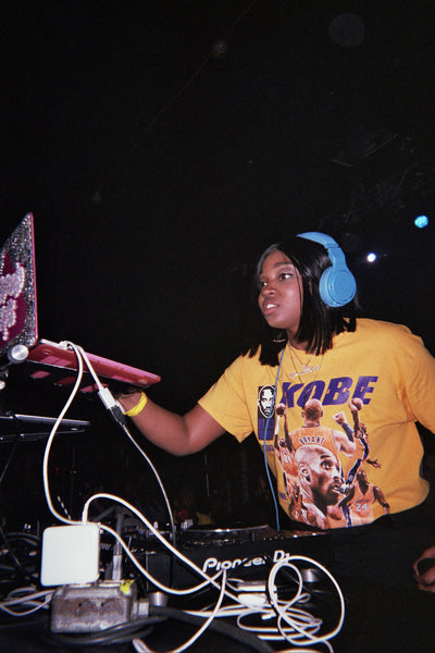 Photograph of person DJing