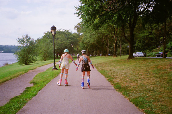 Photograph of two people roller skating down the Schuylkill River Trail in Philadelphia