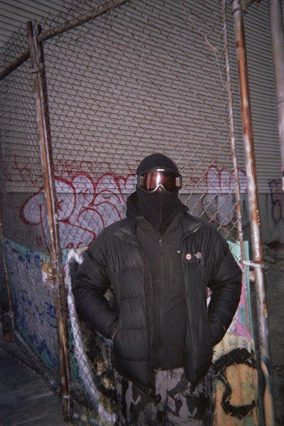 Photograph of person wearing a ski mask