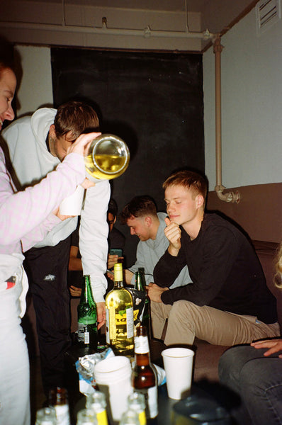 Photograph of people drinking at a party