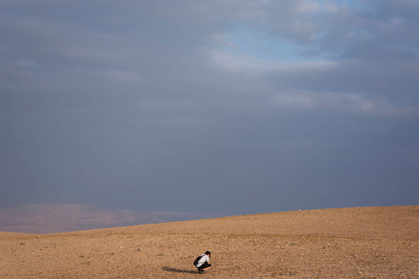 photograph of girl in empty mountain range