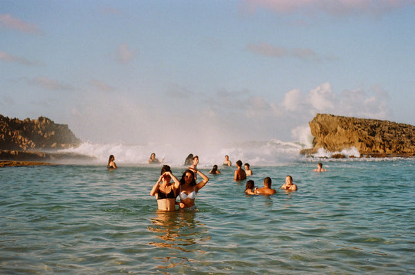 Photograph taken with a Pentax ME camera of people swimming in the ocean