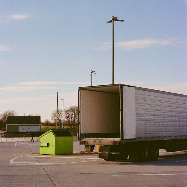 Photograph of an open truck in a parking lot
