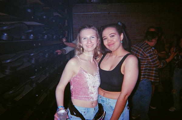 Photograph of two people at a party