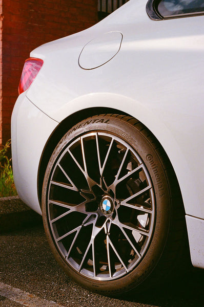 Photograph taken with a Konica Autoreflex TC of the wheel of a BMW