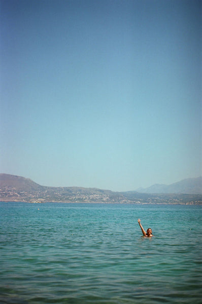 Photograph taken with a Pentax ME camera of person swimming in blue water
