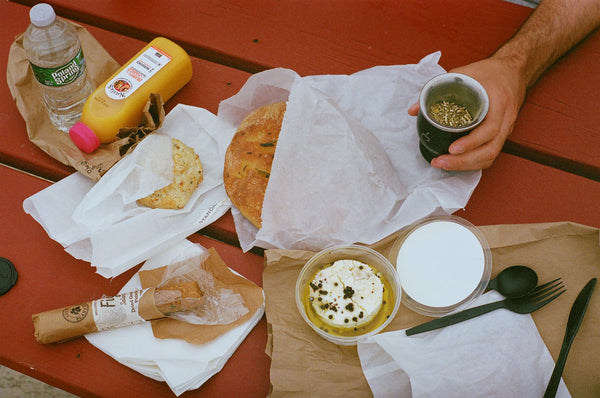 Photograph taken with a Pentax ME camera of food laid out on a picnic table