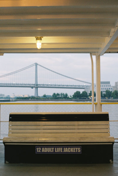 Photograph taken with a Konica Autoreflex TC of a bench on a dock