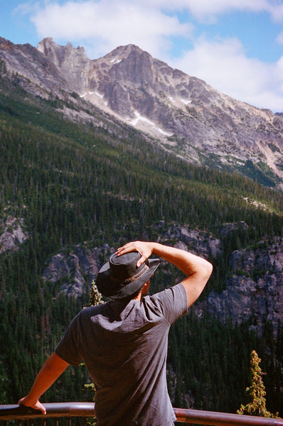 Photograph of a person looking out at a vista