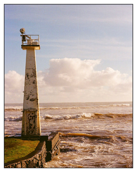 Photograph of a lighthouse and the ocean