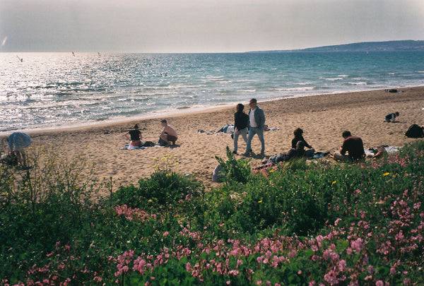 Photograph looking down at people at the beach