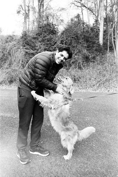 Photograph of a person with a dog