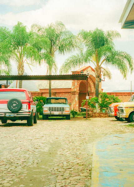 Photograph of parked cars in a tropical place