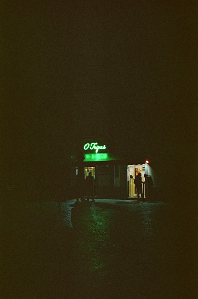 Photograph taken at night of neon sign