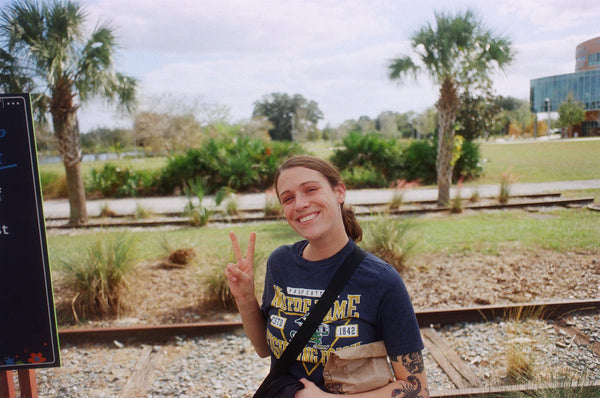 Photograph of someone giving the peace sign