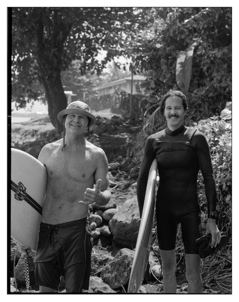 Photograph of two surfers