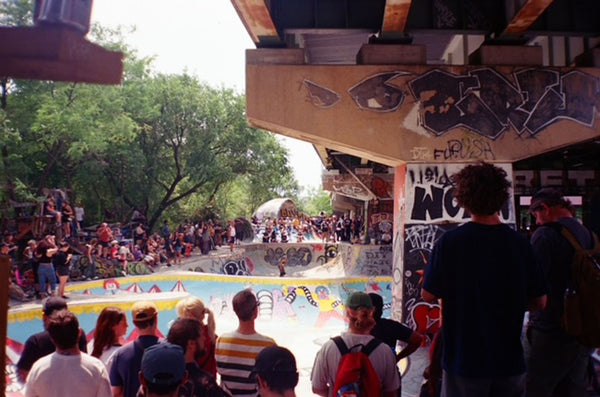 Photograph of a crowd of people at a skate park 