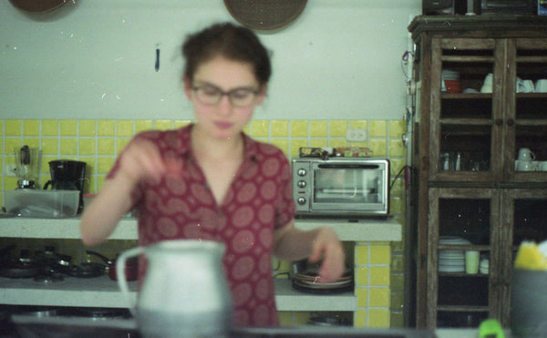 Photograph taken with a Pentax ME camera of person cooking in a kitchen
