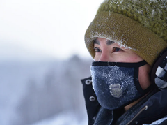 Person wearing reusable face mask