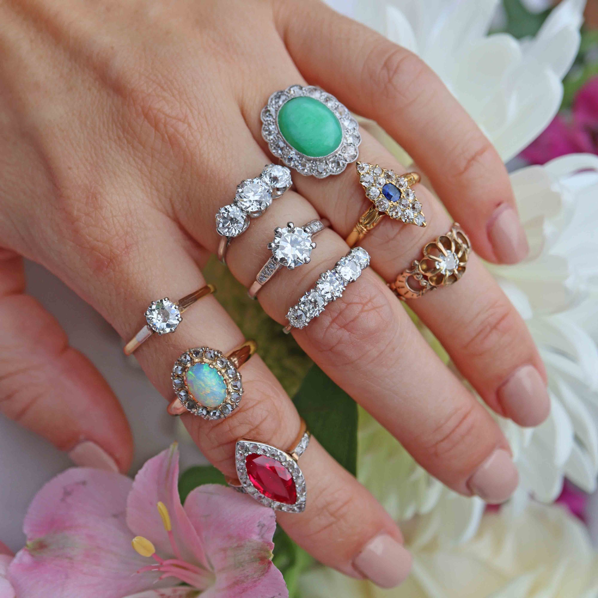 antique engagement rings on a hand