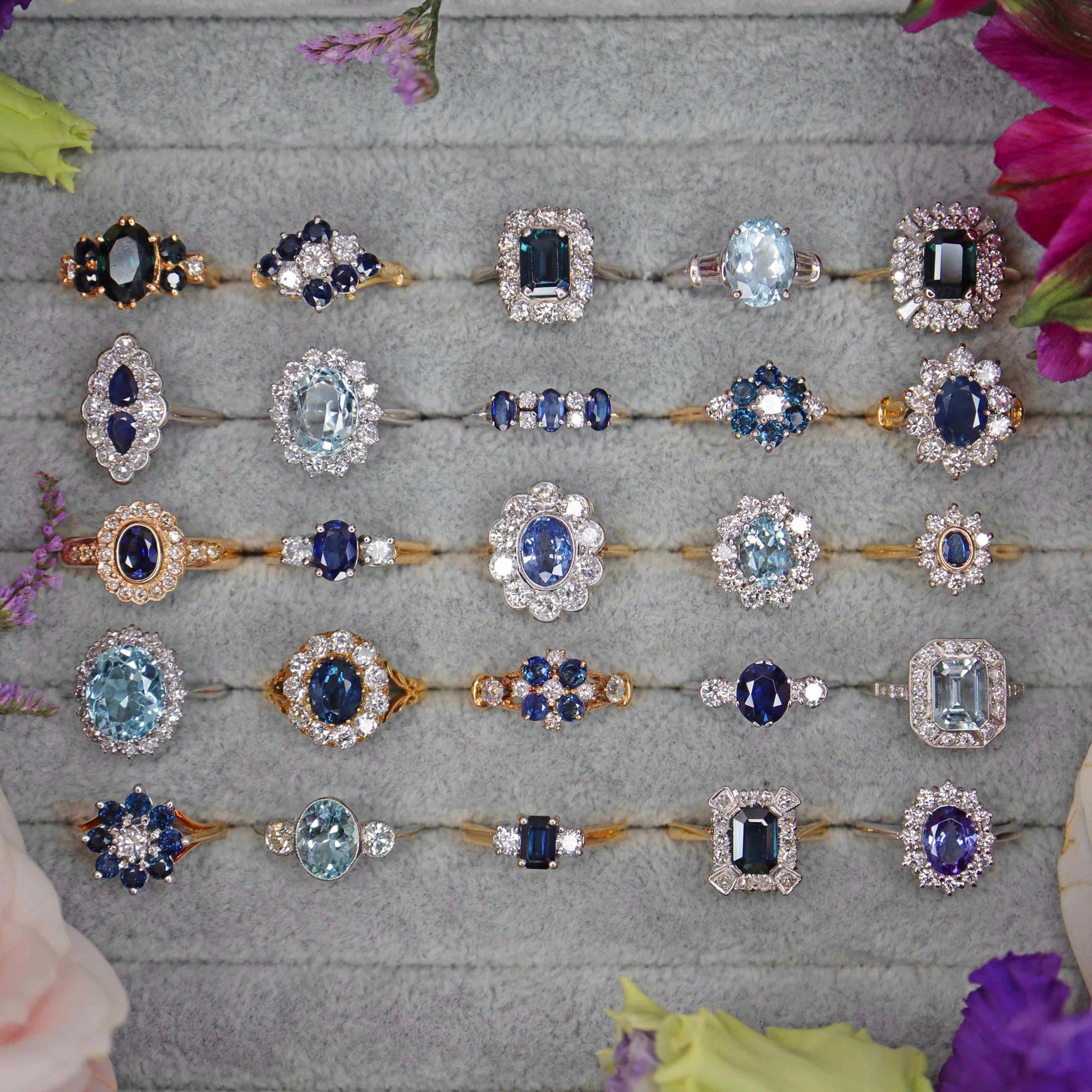 a tray of different sapphire engagement ring styles