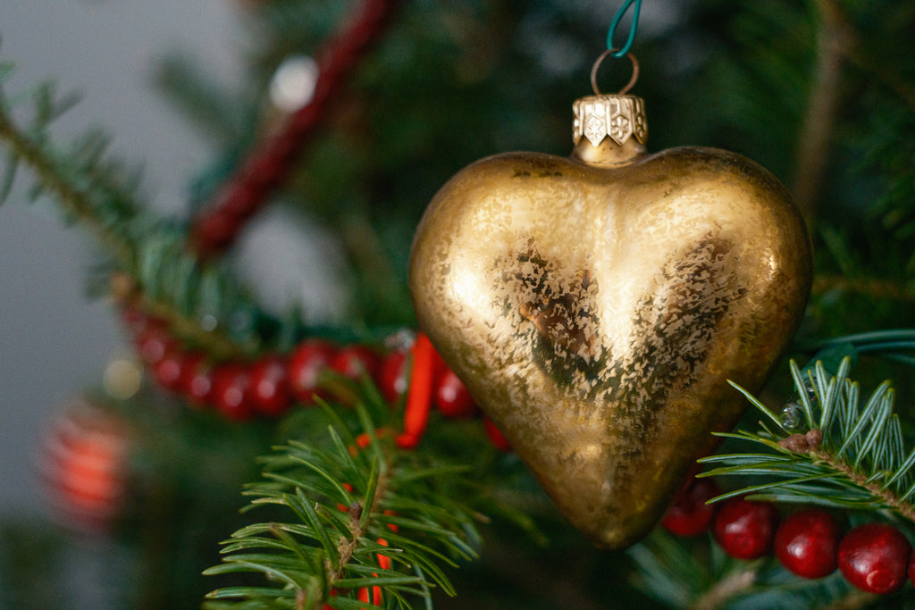 beautiful heart-shaped gold Christmas ornament on the tree