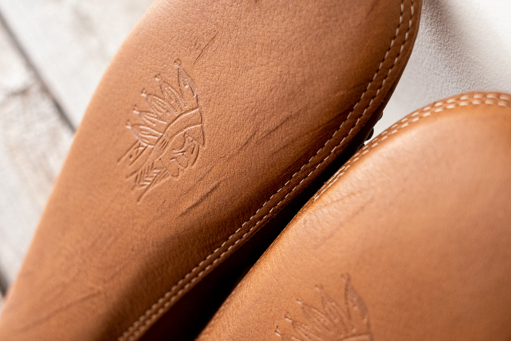 Scratched from wild full grain leather you can see on a pair of authentic moccasins