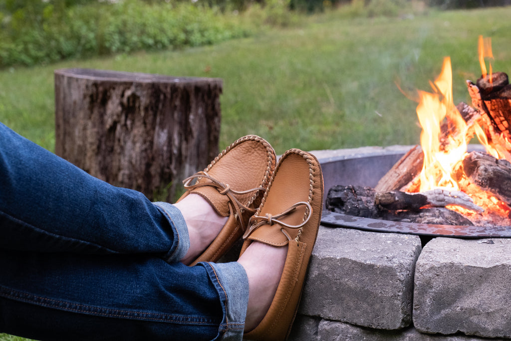 Enjoying an open campfire while Earthing with natural authentic moccasins