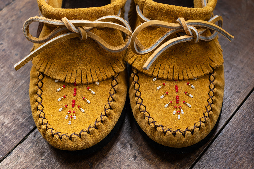 enchanting beaded leaf design on the vamp of Canadian made leather moccasins
