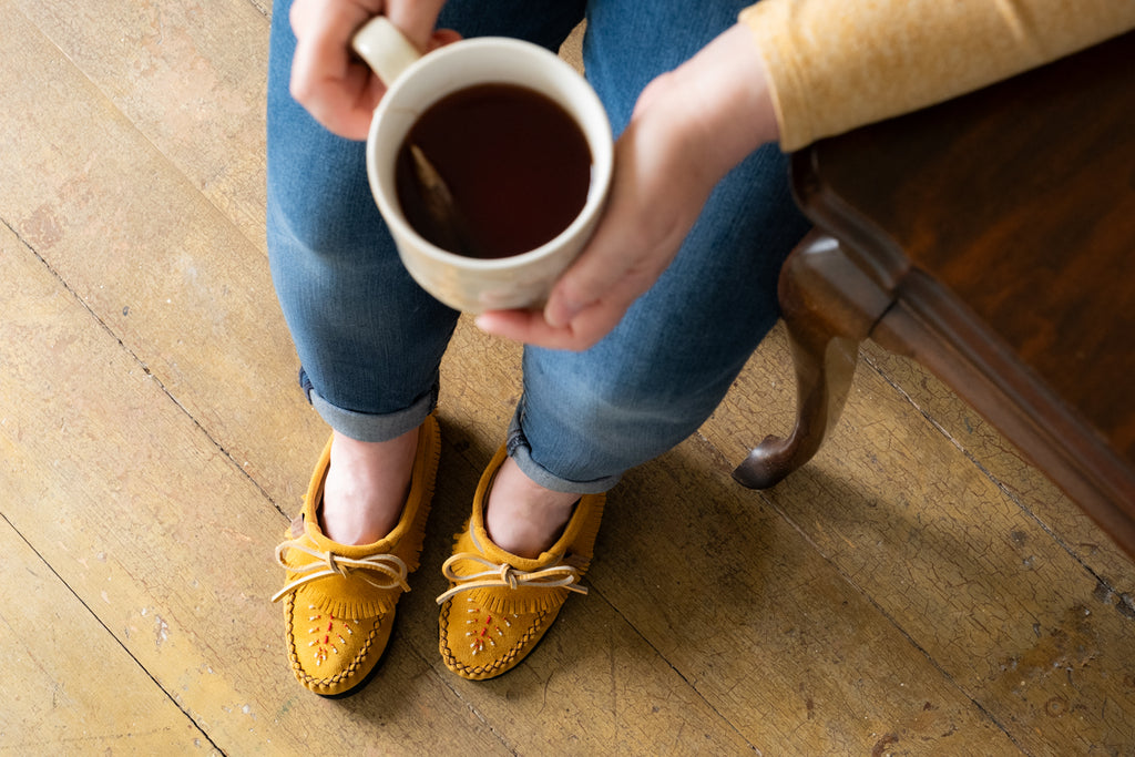 getting cozy with some warm tea and a beautiful pair of Canadian made moccasins