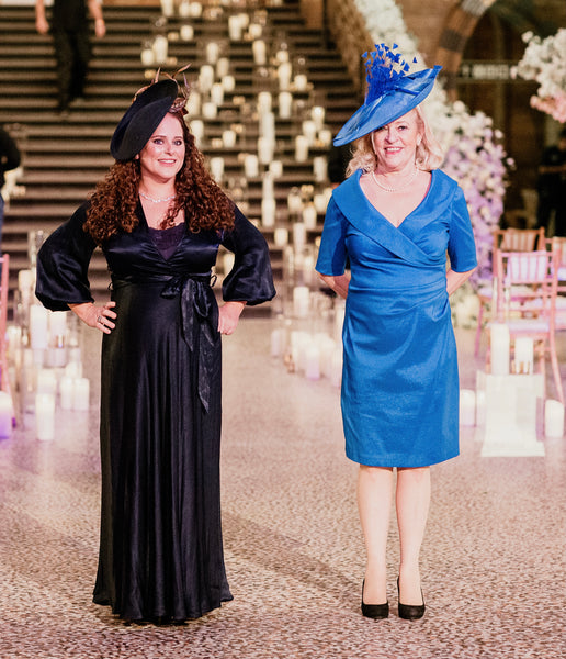 Mother of the groom and sister wearing fabulous hats