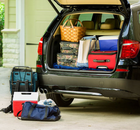 Car packed for road trip with a cooler carrying gluten free snacks