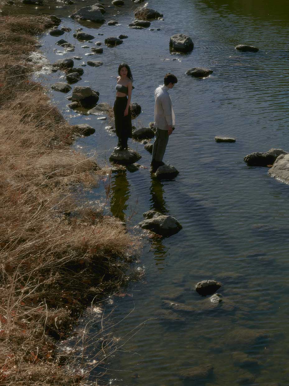 models standing on rocks