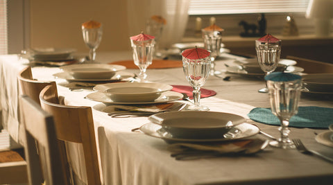 Formal table setting at a dinner party - white table cloth