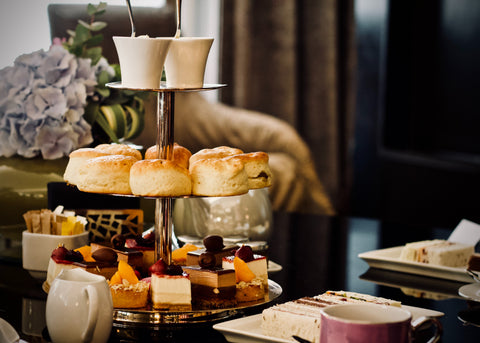 Afternoon tea Cake stand with artisan cakes and tea and coffee