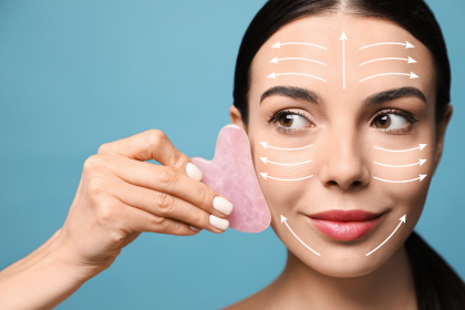 woman performing gua sha 