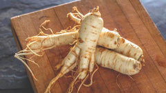 photo of ginseng root on wood-sexual aphrodisiac-www.rdalchemy.com