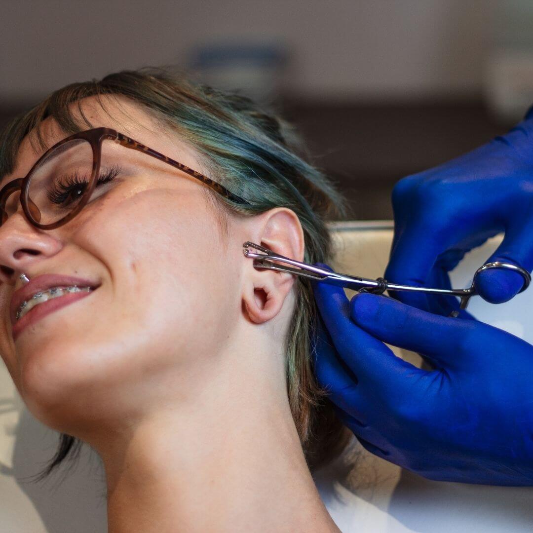 woman-getting-a-cartilage-ear-piercing