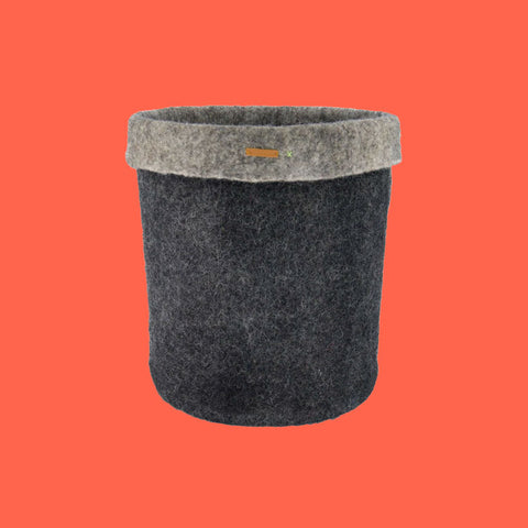 Betterfelt Basket In Black Against A Coral Background